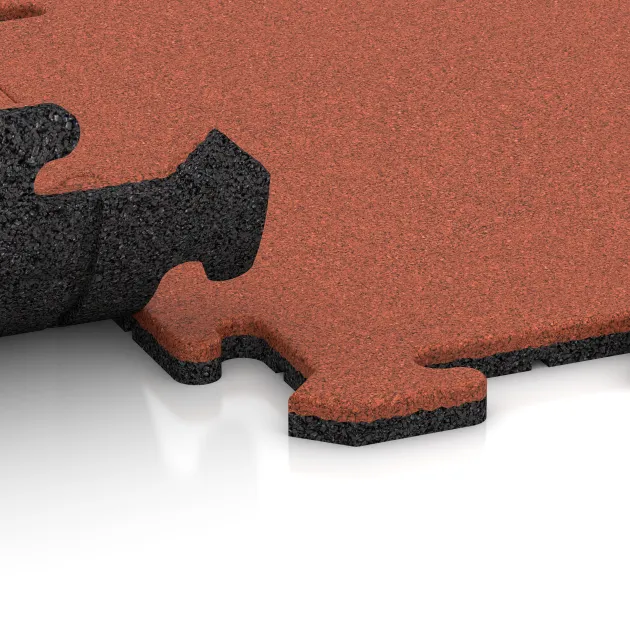 Le gros plan sur le système de connexion des revêtements de sol WARCO 6218 - Dalle sportive 1,8 cm en couleur Rouge-Orange Clair. Les dimensions 500 x 500 x 18 mm.