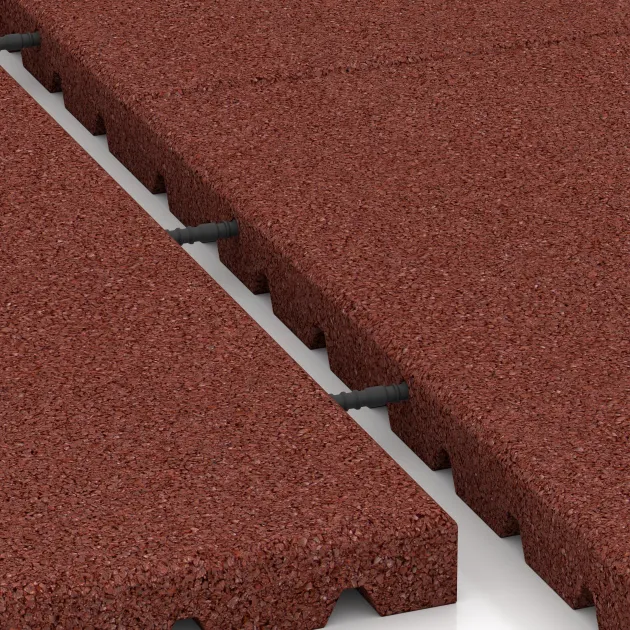 Le gros plan sur le système de connexion des revêtements de sol WARCO 5665 - Tapis aire de jeux 4 cm - EN 1177 ≤ 110 cm en couleur Rouge brique. Les dimensions 1000 x 1000 x 40 mm.