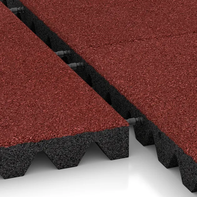 Le gros plan sur le système de connexion des revêtements de sol WARCO 0680 - Dalle amortissante en couleur Rouge corail. Les dimensions 500 x 500 x 50 mm.