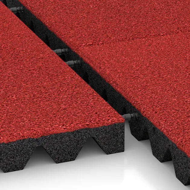 Le gros plan sur le système de connexion des revêtements de sol WARCO 5572 - Dalle amortissante 5 cm - EN 1177 ≤ 145 cm en couleur Rouge corail. Les dimensions 500 x 500 x 50 mm.