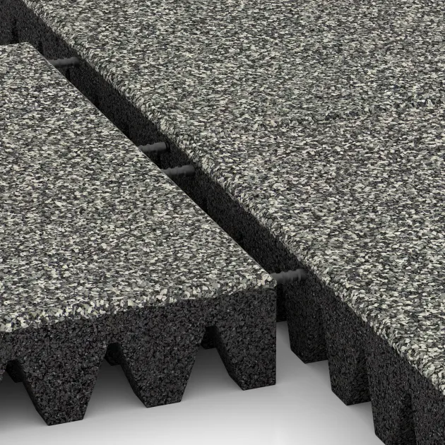 Großaufnahme vom Verbindungssystem von WARCO-Boden 5367 - Fallschutzplatte im Farbdesign Grauer Granit. Abmessungen 500 x 500 x 80 mm.