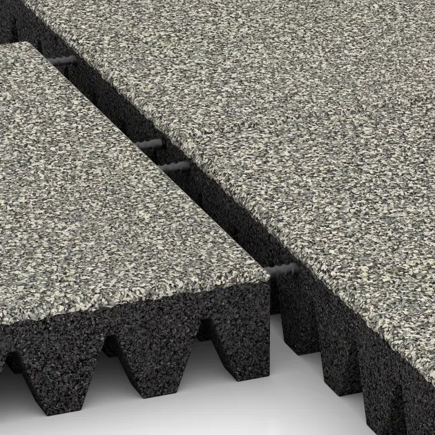 Großaufnahme vom Verbindungssystem von WARCO-Boden 5368 - Fallschutzplatte im Farbdesign Heller Granit. Abmessungen 500 x 500 x 80 mm.