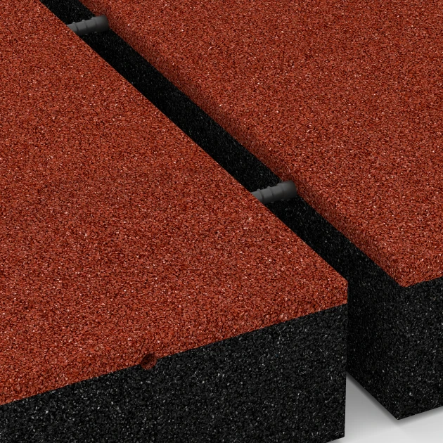 Großaufnahme vom Verbindungssystem von WARCO-Boden 6278 - Fallschutzplatte – 300 cm im Farbdesign Ziegelrot. Abmessungen 50 x 50 x 11 cm.