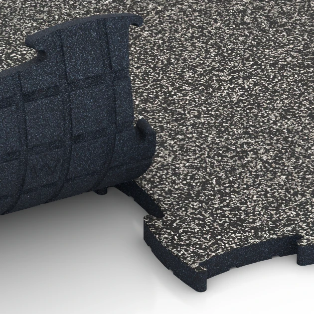 Le gros plan sur le système de connexion des revêtements de sol WARCO 6886 - Dalle Fitness Max en couleur Granit gris foncé. Les dimensions 97,1 x 97,1 x 2,8 cm.
