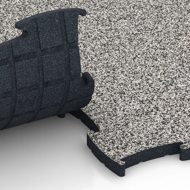Le gros plan sur le système de connexion des revêtements de sol WARCO 6887 - Dalle Fitness Max en couleur Granit gris. Les dimensions 97,1 x 97,1 x 2,8 cm.
